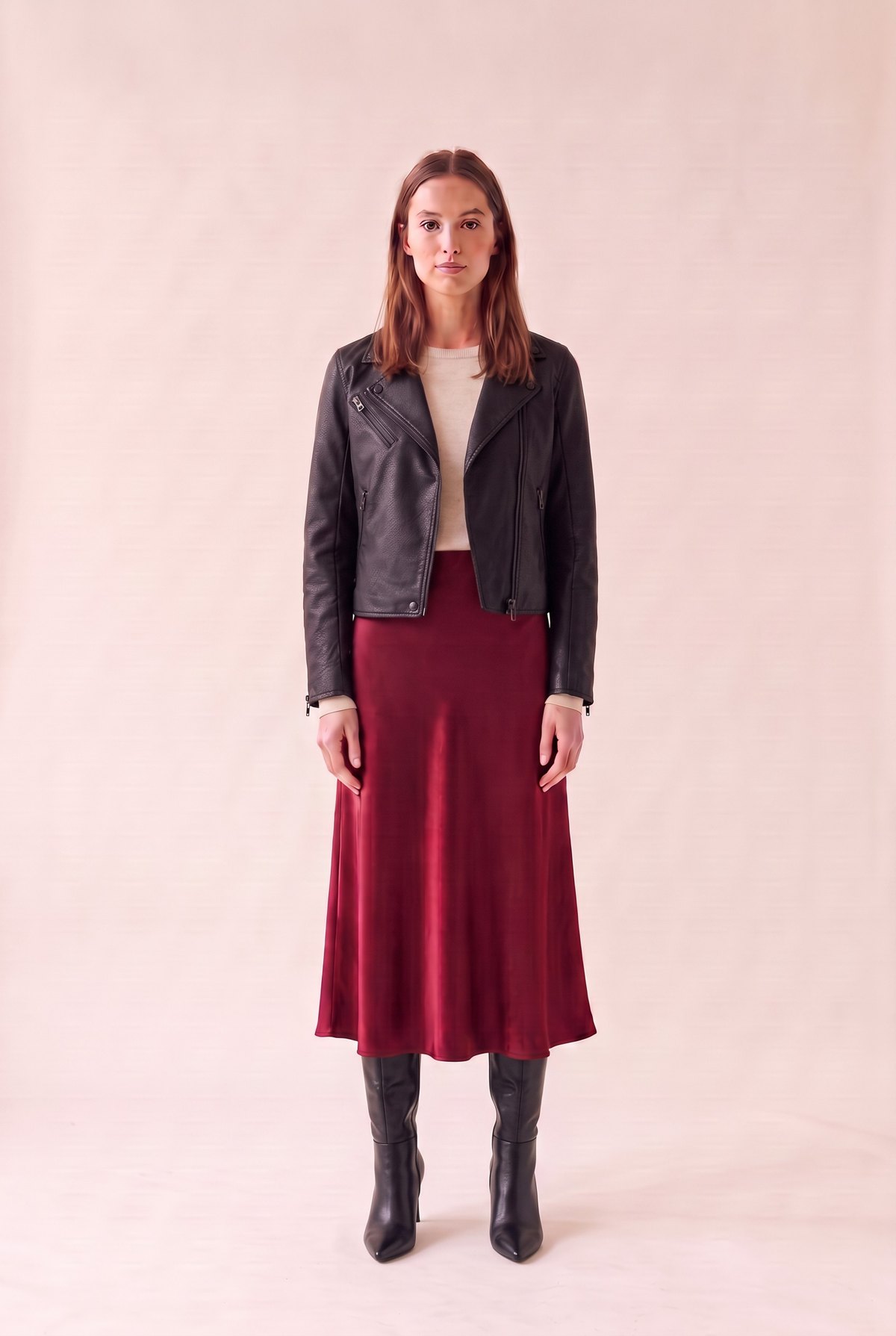 October date outfit, mid look: oatmeal crewneck sweater, wine red satin midi skirt, black vegan leather moto jacket and black pointed knee-high boots